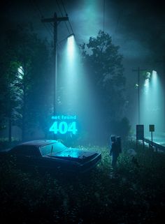 a boat sitting on top of a grass covered field next to a street sign at night