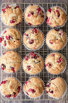 muffins with cranberry topping on a cooling rack, ready to be baked