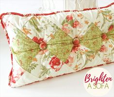 a decorative pillow with flowers on it