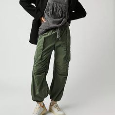 Style No. 79330031; Color Code: 037 Cool In Cargo, These Sporty Pants Are A True Timeless Staple. Fit: Mid-Rise, Tapered Fit And Classic Cargo Silhouette Features: Smocked Waistband With Drawstring Detail, Cargo Pockets Throughout, Banded Hemlines, Sleek Nylon Fabrication Why We <3 It: Just As Effortless As They Are Versatile, These Pants Have Endless Ways To Wear. Care/Import Machine Wash Cold Import Measurements For Size Small Waist: 30.5 In Hips: 42 In Rise: 12.25 In Inseam: 27.25 In 53% Nylo Winter Utility Nylon Parachute Pants, Utility Parachute Pants For Winter, Fall Wide Leg Nylon Bottoms, Wide Leg Nylon Bottoms For Fall, Fall Tapered Leg Parachute Pants With Elastic Waistband, Fall Parachute Pants With Elastic Waistband And Tapered Leg, Winter Utility Straight Leg Parachute Pants, Winter Utility Parachute Pants With Straight Leg, Fall Nylon Cargo Bottoms