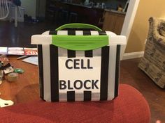 a cell block sitting on top of a red chair