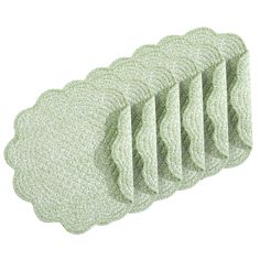 five pieces of green cleaning cloths sitting on top of each other