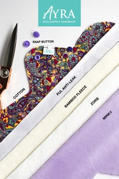 an assortment of different types of fabric and scissors on a white surface with the name ava written below it