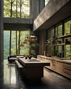 a dining room table and chairs in front of a large window with trees outside it