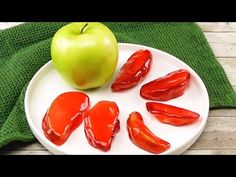 a plate with peppers and an apple on it