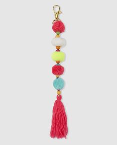 a key chain with tassels and pom poms