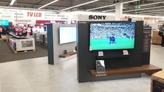 the television is on in the store for people to see it and not be watching