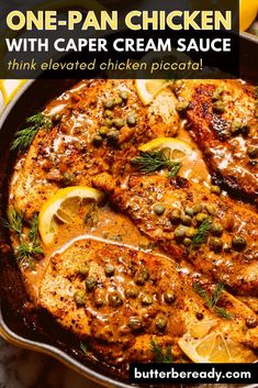 one pan chicken with caper cream sauce in a cast iron skillet topped with lemons and herbs