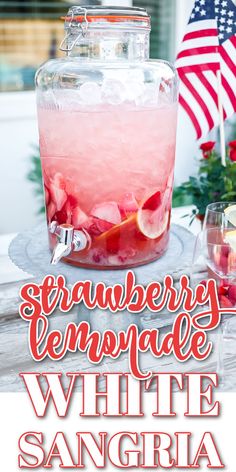 strawberry lemonade white sangria in a glass with ice and garnishes