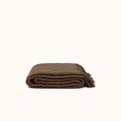 a brown blanket folded on top of each other