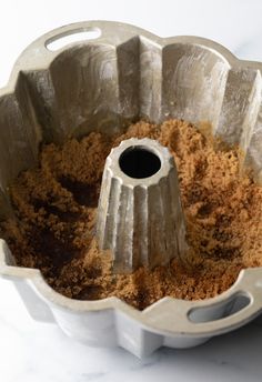 a bundt cake pan filled with brown sugar and crumbs on the inside