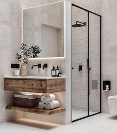 a bathroom with a sink, toilet and shower stall