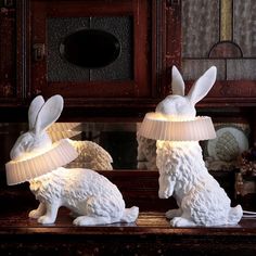 two white rabbit lamps sitting on top of a table