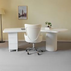 a white desk with two chairs and a lamp next to it in an office setting