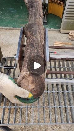 an elephant is standing on a metal grate with it's trunk sticking out