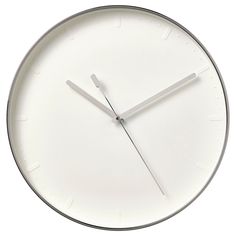 a white clock that is on the wall