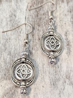 Stunning one-of-a-kind Celtic earrings!! Handcrafted using antique silver plated copper fluted beads, head pins and ear wires and antique silver plated round Celtic beads and oval beads frames!! Length 2" Frame Earrings, Celtic Knot Earrings, Antique Silver Earrings, Celtic Earrings, Earrings Bead, Bead Frame, Oval Earrings, Earrings Antique, Oval Beads