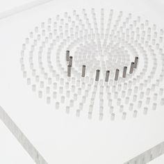 a white table topped with lots of black and white circles on top of each other