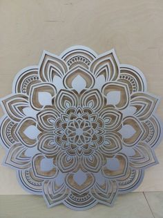 an intricate metal design on the side of a wall