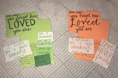 several pieces of paper that have been placed on a bed with some words written on them