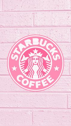 the starbucks logo is painted on a pink brick wall