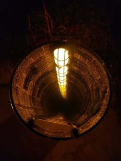 a light that is on in the middle of a tunnel