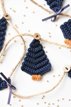 crocheted ornaments hanging from twine on white background