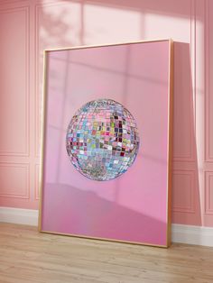 a pink room with a large mirror on the wall