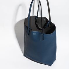 Who doesn't enjoy a buy one get one? This Moynat handbag is exactly that a handbag that can be worn on two sides as well as being carried on the shoulder or by hand which definitely makes a fashion mathematician piece Reversible Tote, Buy One Get One, Get One, Dust Bag