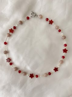 this gorgeous necklace is 15  inches long!  Made with a variety of plastic and acrylic beads!  Please message if you have any questions! ⭐️♥️ Cheap Adjustable Star-shaped Beaded Necklaces, Affordable Red Jewelry With Star Charm, Red Necklace With Star Charm For Gift, Red Necklace With Star Charm As Gift, Star-shaped Beaded Necklace For Gift, Red Star-shaped Beaded Jewelry, Star-shaped Beaded Chain Necklace For Gift, Handmade Red Star Jewelry, Star-shaped Beaded Necklaces For Gifts