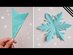 someone is making a snowflake out of paper and then it's cut