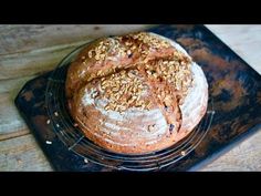 a loaf of bread sitting on top of a cooling rack