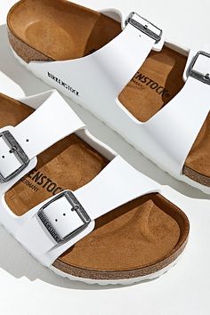 Classic slide sandal from the comfort legends of Birkenstock. Magical contoured cork foot bed and soft leather upper conforms to the shape of your foot for a custom fit as effortless as the design. Pronounced arch support with a layer of foam cushioning, deep heel cup and roomy toe box. Features Birkenstock Arizona sandals Classic Birkenstock sandals Double-strap leather upper Textured rubber outsole Slide sandals style Content + Care Leather, rubber Spot clean Imported Size + Fit Birkenstock regular width Fits like a medium D width | Birkenstock Arizona Core Sandal in White, Men's at Urban Outfitters White Sandles Shoes Outfit, White Birkenstock Outfit Summer, White Birkenstocks Outfit, Birkenstock Outfit Women, White Birkenstock Outfit, Sandles Outfit, How To Wear Birkenstock Sandals, White Summer Sandals, How To Wear Birkenstock