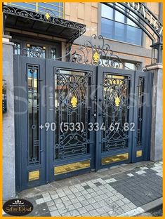 an iron gate on the side of a building