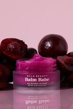 Indulge in the sweet and nourishing Balm Babe Black Cherry Lip Balm. Made with shea, cocoa, and avocado butters, and coconut oil, this natural and vegan lip balm will leave your lips smooth and hydrated. Pucker up and add the cherry on top to your lip care routine. Made in the USA Ingredients: Agave Tequiliana (Agave N Ncla Beauty, Cherry Lip Balm, Scented Lip Balm, Avocado Butter, Daucus Carota, Vegan Lip Balm, Cherry Lips