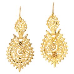 Portuguese Sequile Earrings such as these 19Kt gold lacy dangles have been made since the late 1700's in Portugal. They are classic. Most pair are much larger. This is a medium sized pair made in 1938 in the same design as the 18th century Sequels. They are lighter than paper on the ear. Lacy gold is beautiful and endlessly desirable from work to evening. Clearly not modern yet not stuck in time. Perfect condition. 1 1/4 inches long. .67 inches wide. Weight a weightless 3.92 grams. Spanish Lace, Earrings For Sale, Meme Design, The Ear, 18th Century, Antique Jewelry, Jewelry Inspiration, Jewelry Earrings Dangle, In Time