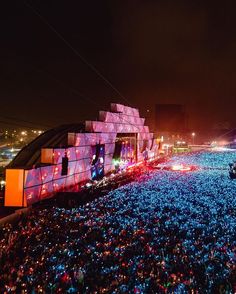 a large group of people gathered together at night