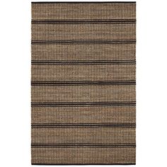 a brown rug with black stripes on it