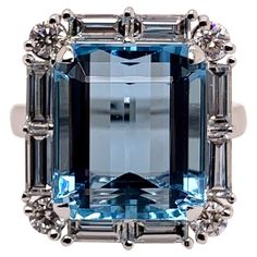 This stunning, ocean blue aquamarine has amazing blue hues and is cut exceptionally well to radiate in any environment. The setting is handmade in platinum and is precisely surrounded by handpicked diamond baguettes and round diamonds that accentuate the symmetry of the aquamarine. Aquamarine: 9.85 carats, emerald cut Diamonds: 1.49 carats, baguettes & round brilliant diamonds Platinum Ring Size: 6.5 & can be sized. One of a kind, cannot be reproduced. Baguette Diamond Wedding Band, Aquamarine Cocktail Ring, Stunning Aesthetic, Diamond Cocktail Ring, Platinum Diamond Rings, Contemporary Ring, Aquamarine Jewelry, Aquamarine Ring, Diamond Cocktail Rings