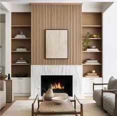 a living room filled with furniture and a fire place next to a wall mounted tv