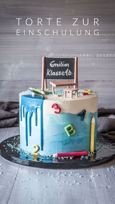 a birthday cake decorated with an image of a beach chair and chalkboard on top