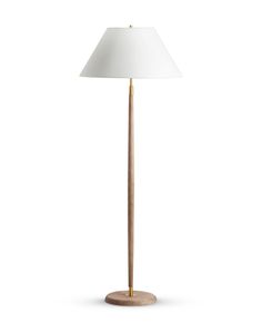 a wooden floor lamp with a white shade on the base and a light bulb at the top