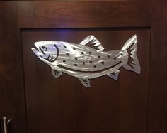 a door with a fish cut out on it