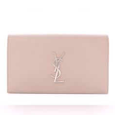 This Is An Authentic Saint Laurent Grain De Poudre Classic Kate Monogram Clutch In Powder Nude . This Stylish Clutch Is Crafted Of Grained Calfskin Leather With A Full Classic Flap In And A Polished Silver Ysl Logo On The Front. The Flap Opens To A Black Fabric Interior With A Small Patch Pocket. Length: 9.25 In Height: 5.75 In Width: 1.50 In Bags Ysl, Hand Clutch, Ysl Logo, Saint Laurent Bag, Classic Flap, Black Fabric, Patch Pocket, Calf Skin, Saint Laurent