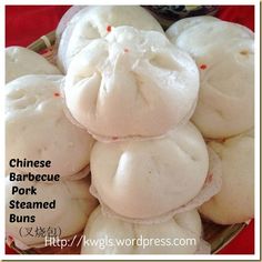 chinese pork steamed buns in a basket on a red tablecloth with the words, chinese barbecue pork steamed buns