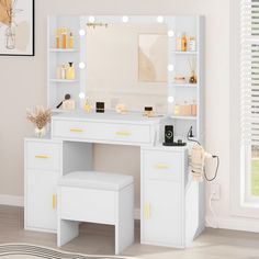 a white vanity with lighted lights and stool