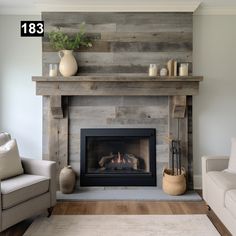 a living room filled with furniture and a fire place in front of a wooden wall