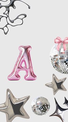 several shiny objects are arranged in the shape of letters, stars, and disco balls