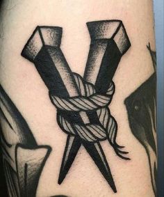 a tattoo with scissors and rope on it