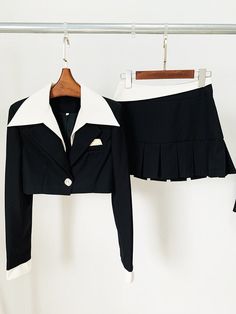 Experience the ultimate in style with this women's crop jacket and mini skirt set. The single button closure, trendy notched collar, and charming pleated mini skirt create a fashion-forward ensemble. Crafted from high-quality polyester, it guarantees both comfort and a chic look, making it perfect for the summer season. Stay effortlessly on-trend with this must-have two-piece set.Specifications Style: High Street Sleeve Style: Regular Sleeve Length(cm): Full Silhouette: Pleated Season: Summer Place Of Origin: China (Mainland) Pattern Type: Solid Pant Closure Type: Zipper Fly Origin: Mainland China Model Number: TS161 Material Composition: Natural fiber Material: Polyester Gender: WOMEN Fabric content: 81% (inclusive) - 90% (inclusive) Fabric Type: Polyester Cotton Dresses Length: Above Kne Fitted Mini Skort For Office, Fall Fitted Mini Length Skirt Suit, Chic Mini Skirt Sets For Fall, Fall Mini Length Fitted Skirt Suit, Chic Mini Length Fall Sets, Chic Fall Mini Length Sets, Fall Fitted Mini Skirt Suit, Fitted Pleated Blazer For Fall, Trendy Fitted Mini Skirt For Formal Occasions